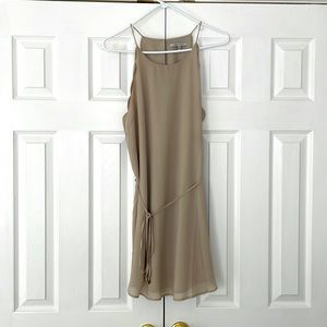 Tan dress with scalloped details